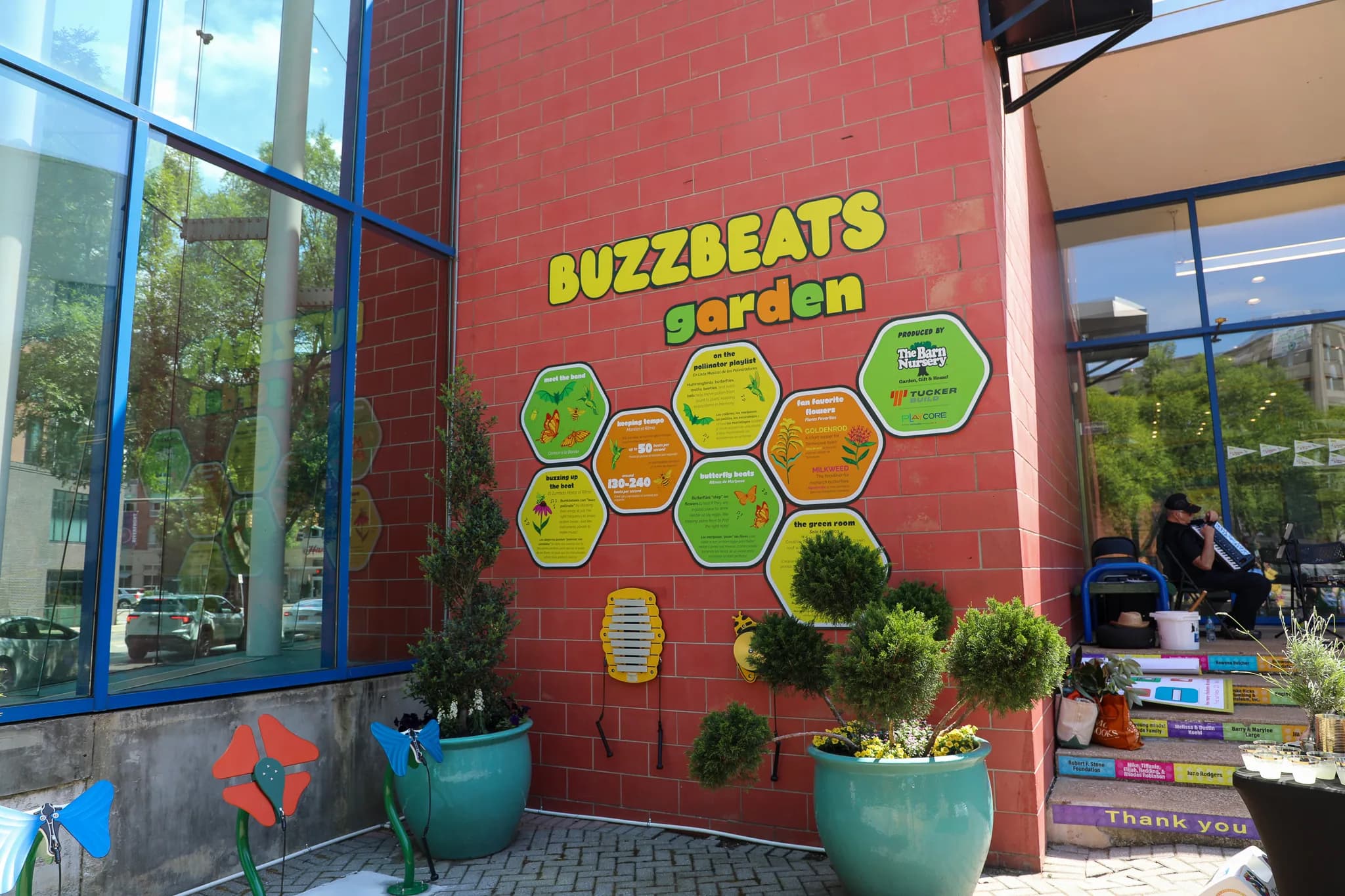 The BuzzBeats garden and pollinator mural on the museum plaza.